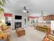 Inviting living room features a cozy fireplace and seamless flow to the kitchen area at 409 Brandy Ln, Mcdonough, GA 30253