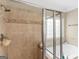 Elegant bathroom featuring tiled shower with glass doors and separate tub at 409 Brandy Ln, Mcdonough, GA 30253