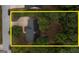 Aerial view shows the layout of the home and large lot with plenty of shade provided by mature trees at 70 Summer Walk Dr, Covington, GA 30016