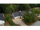 Charming home boasts a well-manicured yard, mature trees, and a spacious driveway leading to an attached two-car garage at 70 Summer Walk Dr, Covington, GA 30016