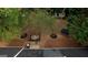 Birds eye view of backyard with a firepit lounge area and trampoline, perfect for outdoor living and activities at 70 Summer Walk Dr, Covington, GA 30016