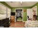 Bedroom with hard wood floors, ceiling fan and walk in closet at 70 Summer Walk Dr, Covington, GA 30016