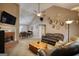 Cozy living room with a fireplace, high ceilings, and leather seating at 70 Summer Walk Dr, Covington, GA 30016