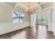 Formal dining room with coffered ceilings, large windows and lots of natural light at 5915 Partners Pass, Cumming, GA 30028