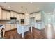 Bright eat-in kitchen with white cabinets, granite countertops and stainless steel appliances at 5915 Partners Pass, Cumming, GA 30028