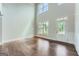 Spacious living room with high ceilings, hardwood floors and bright white trim at 5915 Partners Pass, Cumming, GA 30028
