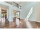 View of the bright open living room featuring beautiful hardwood floors and lots of natural light at 5915 Partners Pass, Cumming, GA 30028