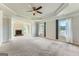 Spacious main bedroom with tray ceiling, fireplace, and natural light at 5915 Partners Pass, Cumming, GA 30028
