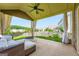 Covered patio with comfortable outdoor furniture and a fire pit at 5915 Partners Pass, Cumming, GA 30028