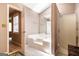 Bathroom with a large soaking tub, glass shower, and plenty of space, creating a spa-like experience at 85 London Ln, Sharpsburg, GA 30277