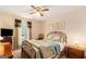 Comfortable bedroom featuring a metal frame bed, vintage furnishings, and neutral decor at 85 London Ln, Sharpsburg, GA 30277