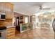 Open kitchen with hardwood floors, a breakfast bar, and a lovely view of the dining area at 85 London Ln, Sharpsburg, GA 30277