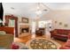 Inviting living room with a cozy fireplace, plush seating, and abundant natural light at 85 London Ln, Sharpsburg, GA 30277