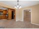 Dining area featuring hardwood floors, elegant chandelier, and access to the kitchen at 3 Ridge Dr, Hampton, GA 30228