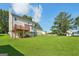 View of the home's backyard featuring a deck and a gently sloping lawn, enhancing outdoor living at 2326 Sand Dollar Sw Ct, Atlanta, GA 30331