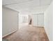Basement featuring carpet, tile flooring, and multiple doors, revealing the home's layout at 2326 Sand Dollar Sw Ct, Atlanta, GA 30331