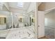 Bright bathroom features a jetted tub and mirrors, offering a luxurious spa-like experience at 2326 Sand Dollar Sw Ct, Atlanta, GA 30331