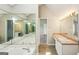 Primary bathroom with jetted tub and large mirrored walls at 2326 Sand Dollar Sw Ct, Atlanta, GA 30331
