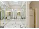 Luxurious primary bath features a jacuzzi tub with mirrored wall, and a separate shower stall at 2326 Sand Dollar Sw Ct, Atlanta, GA 30331