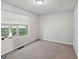 Bedroom with large window offers peaceful outdoor views at 2326 Sand Dollar Sw Ct, Atlanta, GA 30331
