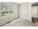 Bright room with carpet and a large window offering a view of the outside at 2326 Sand Dollar Sw Ct, Atlanta, GA 30331