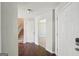 Traditional foyer with hardwood floors, staircase, entry closet and neutral paint at 2326 Sand Dollar Sw Ct, Atlanta, GA 30331