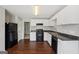 Kitchen featuring stainless steel appliances, bright white cabinets and sleek countertops at 2326 Sand Dollar Sw Ct, Atlanta, GA 30331