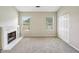 Inviting living room featuring a fireplace, windows, and ample closet space at 2326 Sand Dollar Sw Ct, Atlanta, GA 30331