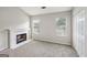 Living room featuring a fireplace and large windows at 2326 Sand Dollar Sw Ct, Atlanta, GA 30331