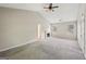 Open-concept living room features a fireplace, ceiling fan and windows allowing ample sunlight at 2326 Sand Dollar Sw Ct, Atlanta, GA 30331