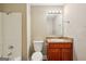 Standard bathroom features a vanity with brown countertop and white shower-tub combination at 4496 Housworth Dr, Lithonia, GA 30038