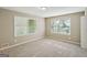 Cozy bedroom with neutral carpet and paint, naturally lit by the two large windows at 4496 Housworth Dr, Lithonia, GA 30038