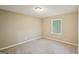 A cozy bedroom with neutral carpet and a window providing natural light is perfect for relaxation at 4496 Housworth Dr, Lithonia, GA 30038
