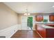 The Dining Area has a chandelier, hardwood floors, and sliding glass door to backyard at 4496 Housworth Dr, Lithonia, GA 30038