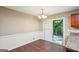 Dining area with hardwood floors, chandelier, and glass doors to a deck and backyard at 4496 Housworth Dr, Lithonia, GA 30038