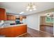 Eat-in kitchen with stainless steel microwave and open view into the living space at 4496 Housworth Dr, Lithonia, GA 30038