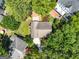 An aerial view shows mature trees surround homes with lush green landscaping at 1186 Village Ne Cv, Atlanta, GA 30319