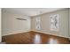 This sunny bedroom has hardwood floors and plantation shutters at 1186 Village Ne Cv, Atlanta, GA 30319