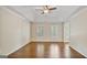 Bright bedroom with hardwood floors, natural light, and a tray ceiling at 1186 Village Ne Cv, Atlanta, GA 30319
