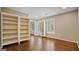 Bright bonus room featuring hardwood floors, recessed lighting, and built-in bookshelves at 1186 Village Ne Cv, Atlanta, GA 30319