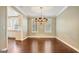 Elegant dining room featuring a chandelier, hardwood floors, and natural light at 1186 Village Ne Cv, Atlanta, GA 30319