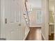 Entryway with hardwood floors, staircase, and transom windows providing ample light at 1186 Village Ne Cv, Atlanta, GA 30319