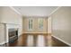 Bright living room with fireplace, hardwood floors and natural light from windows at 1186 Village Ne Cv, Atlanta, GA 30319