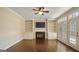 Comfortable living room with fireplace, built-in shelving and a ceiling fan at 1186 Village Ne Cv, Atlanta, GA 30319