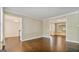 Living Room with hardwood floors, and large entries into the foyer and dining room at 1186 Village Ne Cv, Atlanta, GA 30319