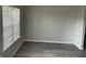 Bedroom with modern gray walls, white trim, and large window at 737 Outlook Way, Atlanta, GA 30349