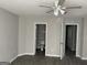 Bedroom with a ceiling fan and view of the bathroom and other rooms at 737 Outlook Way, Atlanta, GA 30349