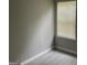 Bright bedroom with light gray walls, modern vinyl flooring, and a window with blinds at 737 Outlook Way, Atlanta, GA 30349
