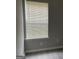 Bedroom with gray walls, vinyl floors, and a window with white blinds at 737 Outlook Way, Atlanta, GA 30349