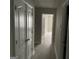 Hallway with white doors, leading to bedroom and bathroom views at 737 Outlook Way, Atlanta, GA 30349